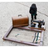 A vintage singer sewing machine and loom