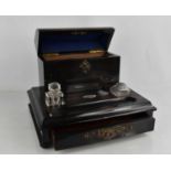 A 19th century coromandel stationary stand, with inkwell, the domed lid with key and drawer below,