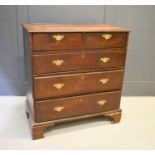 A Georgian oak chest of drawers, two over three long graduated drawers raised on bracket feet101cm