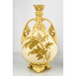 A Royal Worcester vase painted with flowers, on a cream ground, with gilded handles, circa 1900,