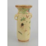 A Japanese vase of cylindrical form, with elephant handle, the top painted with a pheonix, with