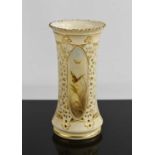 A 19th century Royal Worcester ivory vase with pierced decoration, with three panels painted with