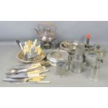 A group of pewter and silver plated items to include tankards, kettle, flatware and other items
