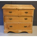 An antique pine chest of three drawers82cm by 90cm by 44cm