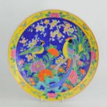 A 20th century Chinese enamelled plate decorated with exotic birds and flowers, mark to base31cm