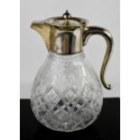 A Victorian silver and cut glass claret jug, London 1900, 20cm high.