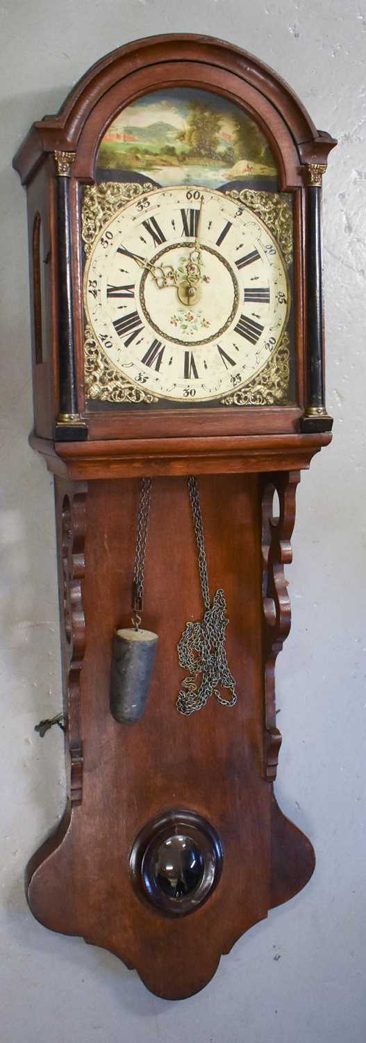 A Victorian oak country wall clock, with painted dial and arched landscape depicting horseman and