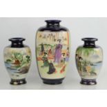 An early 20th century Japanese Satsuma ware vase with panel decoration depicting figures in a