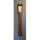 A George III mahogany stick barometer, the case inlaid with satinwood decoration, with a split