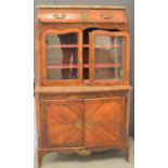 A 19th century French kingwood cabinet, with shaped marble top above single drawer and shaped and