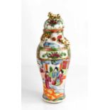 A 19th century Chinese canton famille rose vase with domed cover, with gilt finifal, the body