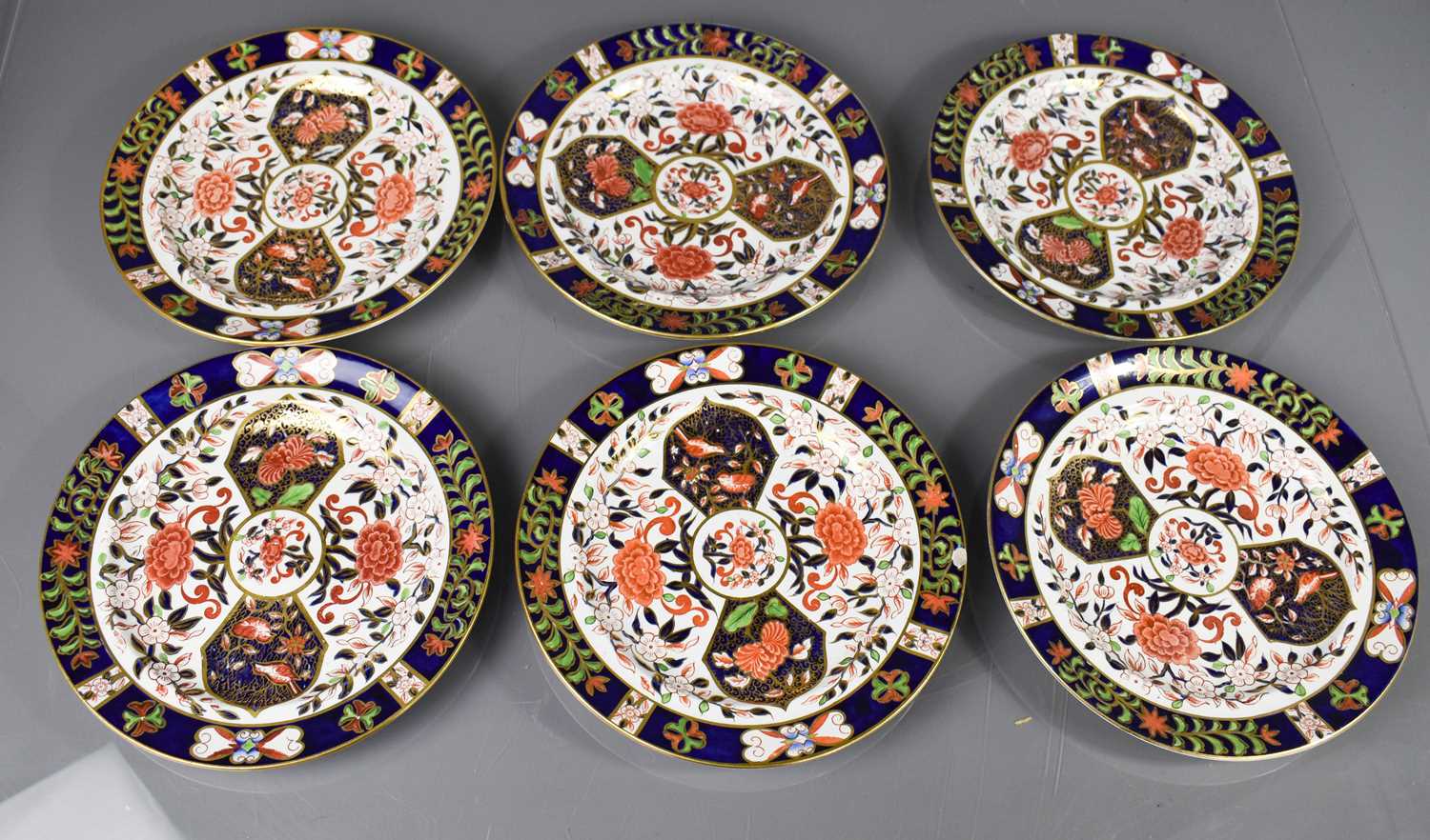 Twelve Royal Crown Derby plates, six 26cm diameter, six 22cm diameter, in the old imari pattern,