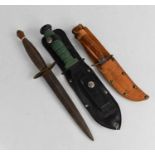 A Mora Swedish knife, a hunting knife and a reproduction Commando dagger,