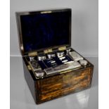 A 19th century coromandel dressing table box, with brass inlay, fitted with two secret drawers,