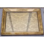 An antique giltwood wall mirror, with decorative composition mouldings to the frame, 66 by 83cm.