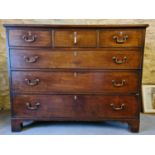 A Georgian mahogany chest of drawers with ivory inlaid keyholes and raised on bracket feet, 103cms