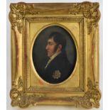 A 19th century oil on metal portrait of a decorated gentleman, in a giltwood table frame, 14 by