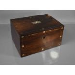 A 19th century rosewood vanity box, with fitted interior and mirror to the inside lid.
