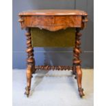 A Victorian figured walnut work box and sewing table with rectangular lid revealing a satinwood