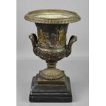 A classical style bronze urn jardiniere, of flared form, the body with putti at a bacchanalian feast