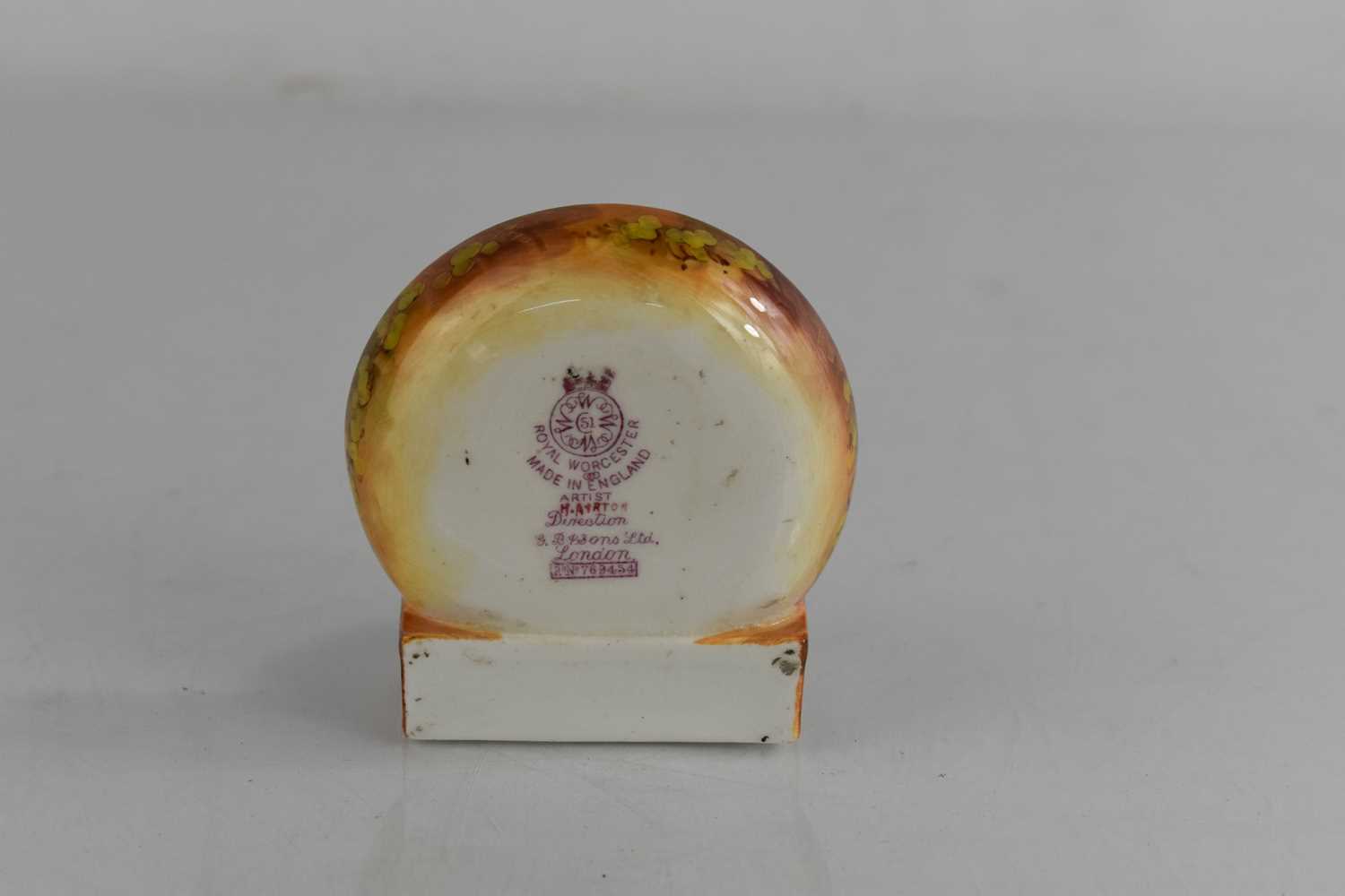 A Royal Worcester porcelain matchbox holder, painted with fruit and signed Ayrton, with Strike board - Image 2 of 3