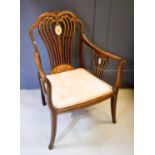 A 19th century inlaud rosewood salon chair, with curved spindle back, inlaid with ivory, the swept