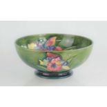 A Walter Moorcroft bowl in the Orchid pattern, signed to base21.5cm diameter