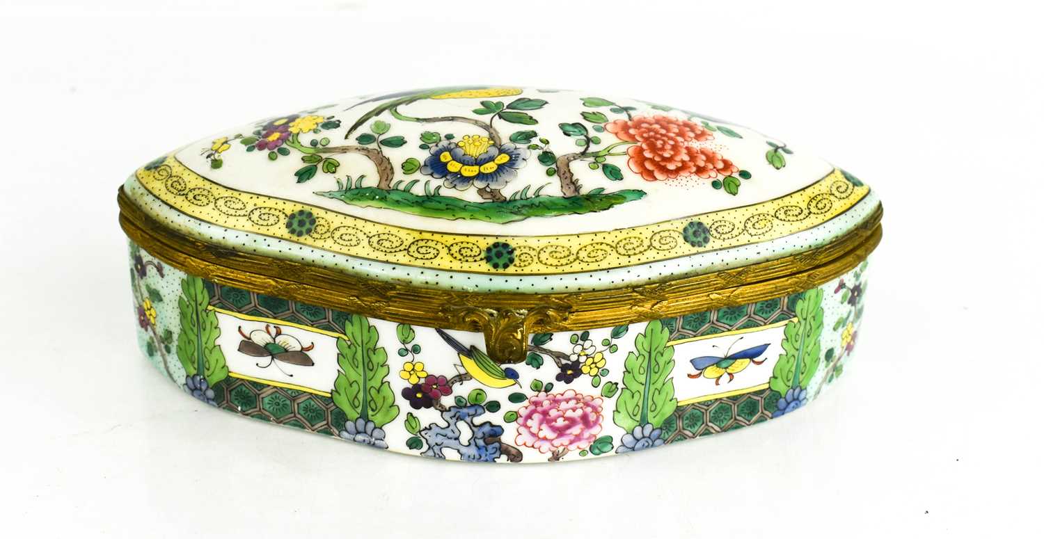 A Victorian polychrome porcelain box, of oval form, depicting bird amidst flowers to the lid, 19cm