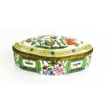 A Victorian polychrome porcelain box, of oval form, depicting bird amidst flowers to the lid, 19cm