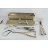 A group of midwifery equipment to include forceps