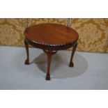 A mahogany occasional table with cabriole legs with ball and claw feet