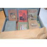 A vintage suitcase together with a quantity of antique childrens books