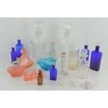 A group of glass medicine bottles, decanters and Art Deco perfume bottles