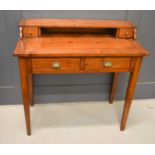 An antique desk, with raised back containing two drawers, and two drawers below, 82 by 95 by 45cm.