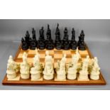 A 20th century Karma Sutra chess set, the board measures 54cm by 54cm.