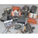 A group of cameras to include Praktica IV B, Polaroid sun 600, Halina 3000, Zenit EM, Ilford,