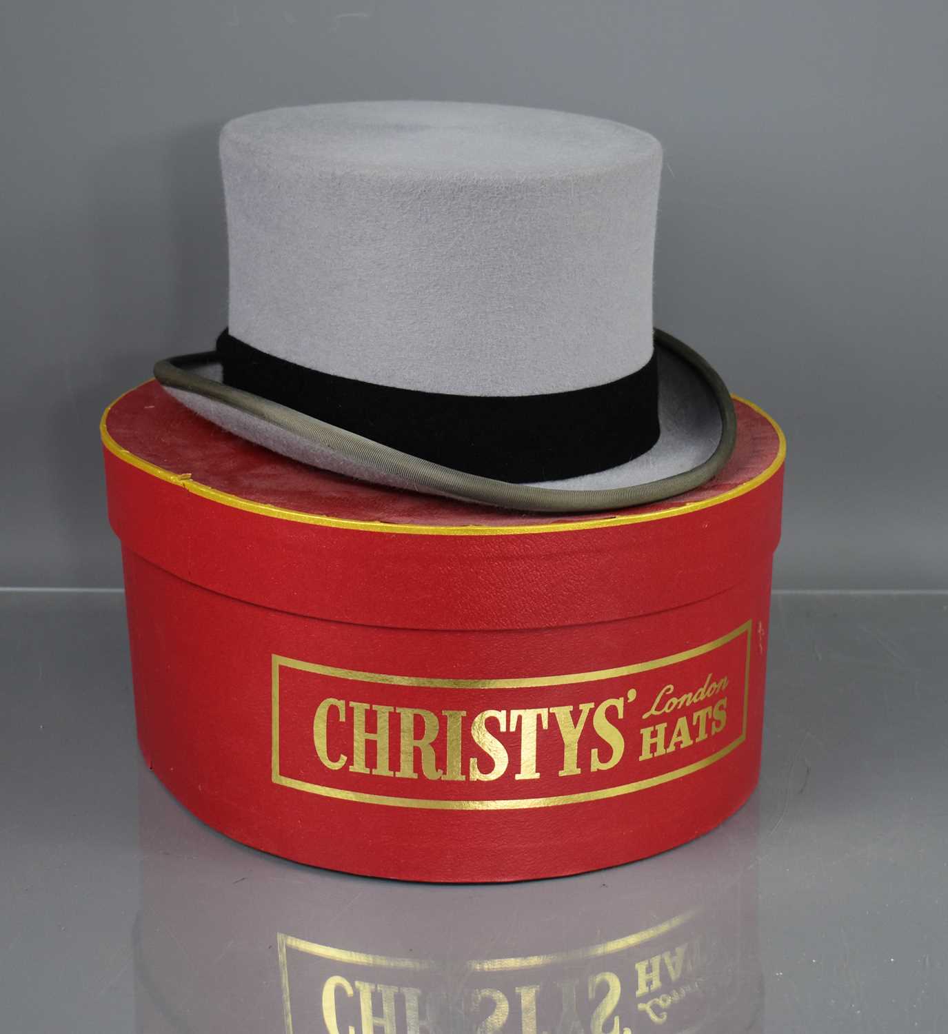 A 20th century Christy's of London grey top hat, with the original box and tags, 7 5/8, 62cm.