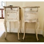 A pair of antique French marble top bedside cabinets.