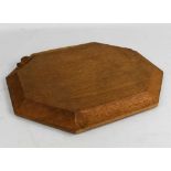 Robert Thompson 'Mouseman' oak octagonal bread board with signature carved mouse to the edge,