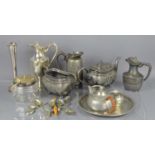 A vintage pewter tea service comprising of a tea pot, milk jug, sugar bowl and tray together with