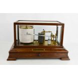 A vintage barograph, circa 1930, in oak and glass case, with drawer to base, complete with spare ink