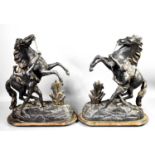 A pair of Victorian spelter rearing horses, 41cm high.