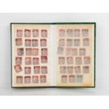 A stamp album containing forty four Penny Red's, New Zealand and other examples.