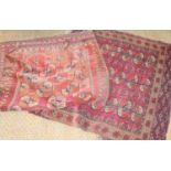Two Middle Eastern rugs, red ground with stylized borders a/f