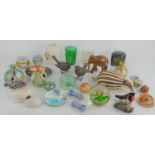 A group of collectible ceramics and glass paperweights to include Medina glass vase, glass bird,