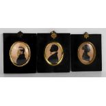 Three Victorian silhouette profile portraits, one of a lady with text verso A Britton, the other two