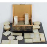 A large quantity of 19th century Chinese mother of pearl gaming counters, carved in low relief