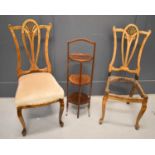 A pair of antique bedroom chairs with wheat sheaf backs, together with a mahogany cake stand