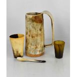 A horn tankard, together with two antique horn beakers and a horn spoon.