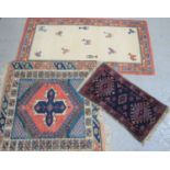 A Bergama rug late 19th century together with an Eastern cream ground rug depicting animal imagery